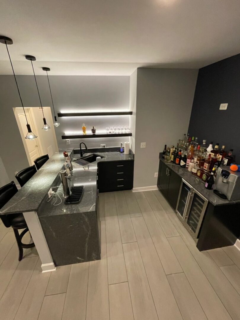 A kitchen with a bar and wine storage