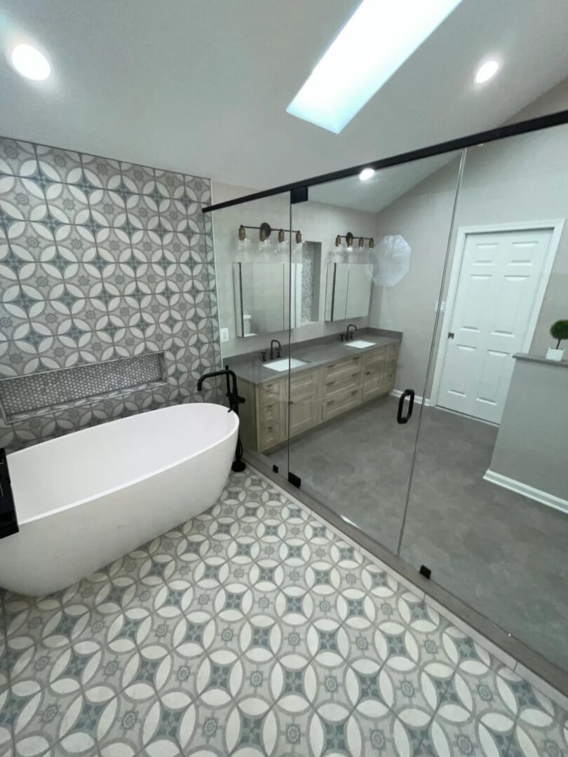 A bathroom with a tub, sink and mirror.