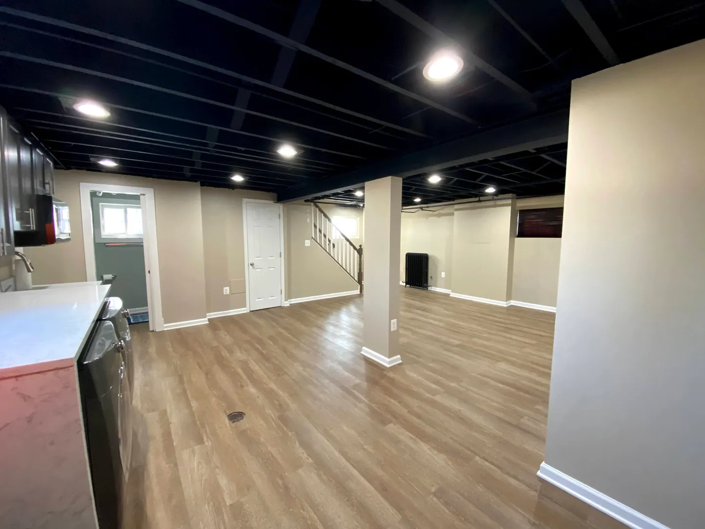 A room with black ceiling and wooden floors