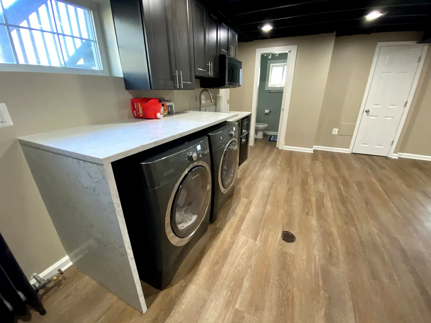 A room with two black and white appliances
