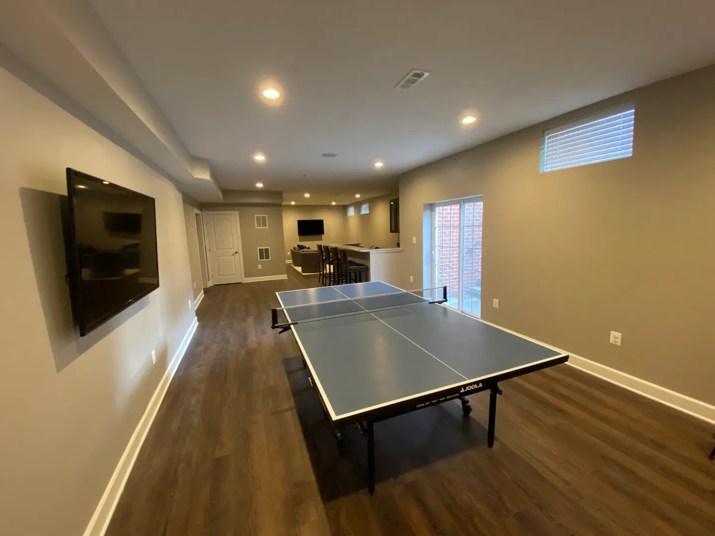 A ping pong table in the middle of a room.